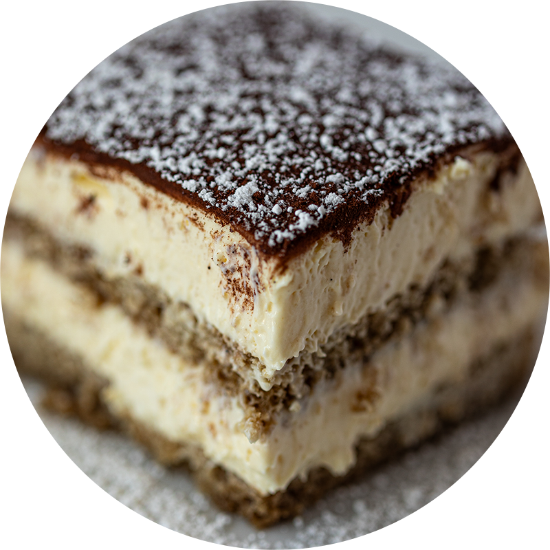 House-made tiramisu at Sorella Italian, layered with espresso-soaked ladyfingers and mascarpone, finished with cocoa powder and powdered sugar
